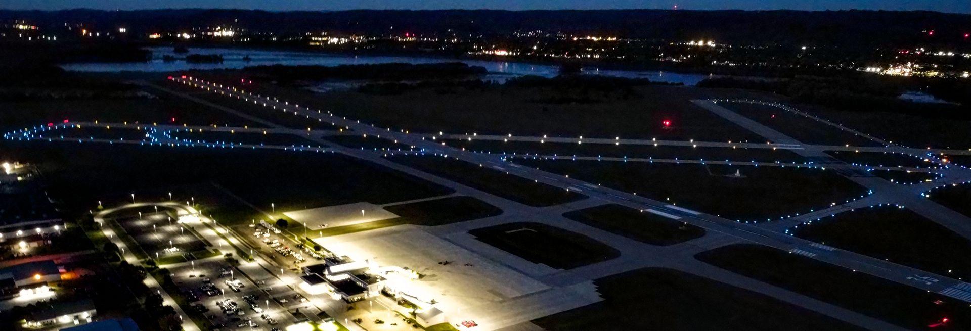 Aerial view of runway and taxiway lights at night
